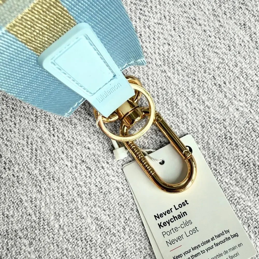 NEW Lululemon Never lost Keychain Wordmark Baby Blue Gold
